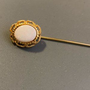 Opal and yellow gold pin